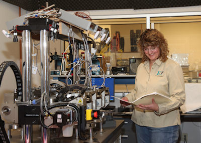 Dawn Lissy inspects the results of a medical device test.